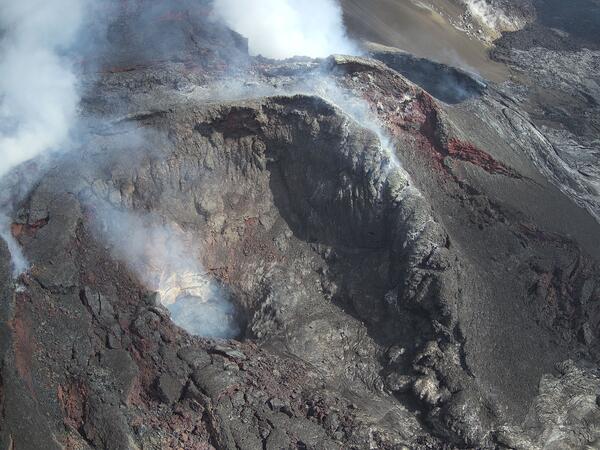 Color photograph of volcanic vents that are degassing