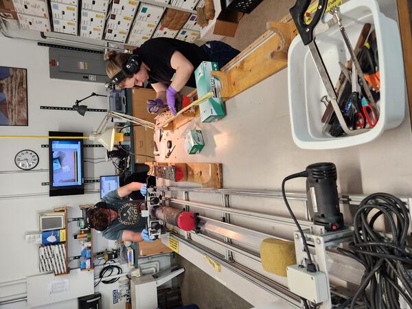 Interns working with sediment cores in a laboratory