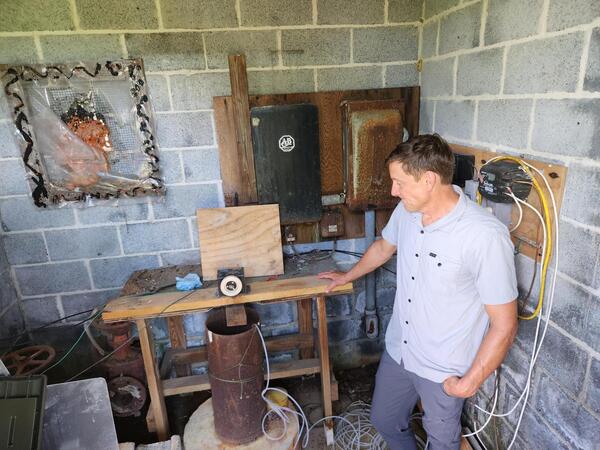 Scientist standing next to a state observation well
