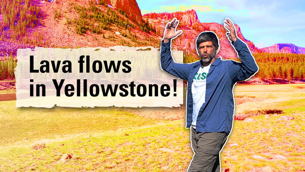 Thumbnail image of a man with his arms in the air in a meadow with cliffs in the background