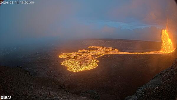 Color webcam image showing lava fountain and lava flow within crater as sunsets
