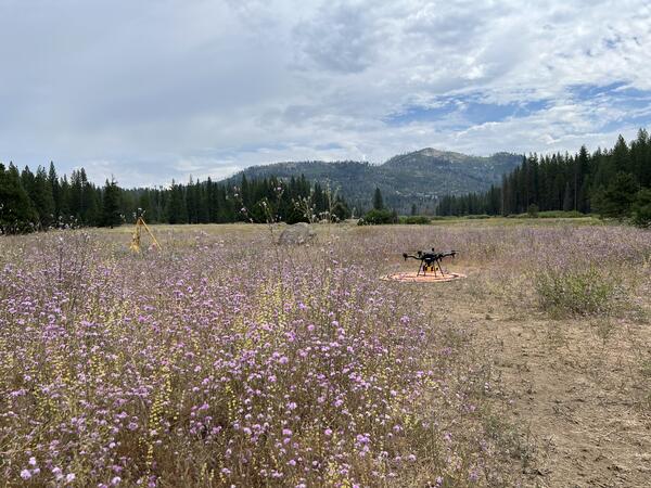 UAS craft, instruments, and landing pad in mountain clearing