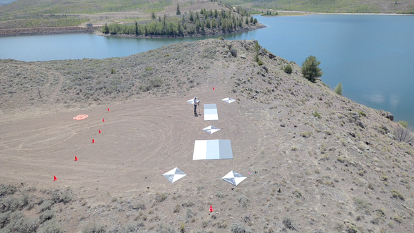 Overhead view of reservoir shore showing calibration/validation equipment used by drone sensors.