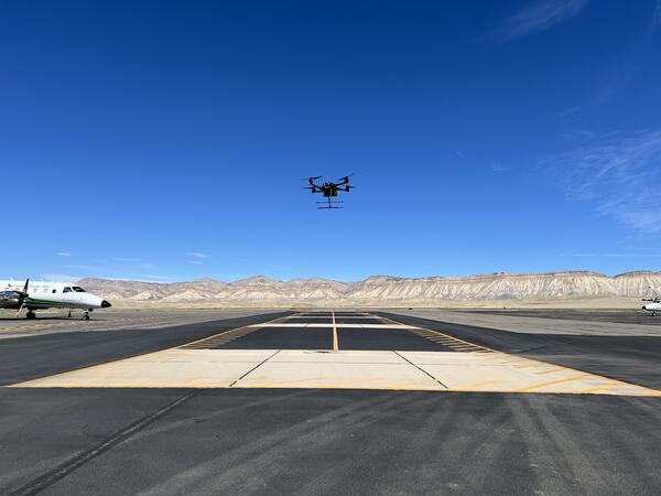 Drone hovering above airstrip at Grand Junction Regional Airport.