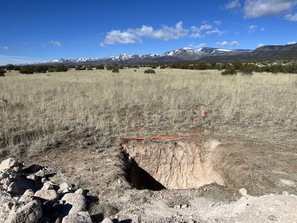 Photograph showing pit excavated on the Puya Fault in northern New Mexico to determine ages of faulted surfaces