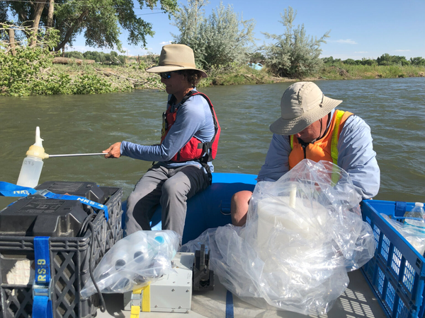 Researchers collecting surface-water samples on the Animas River, New Mexico, June 2022