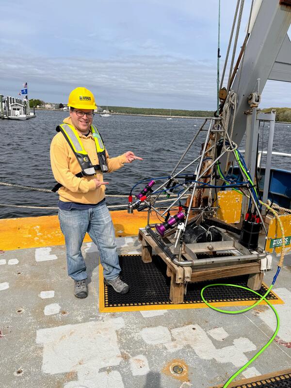 Person on ship pointing to equipment