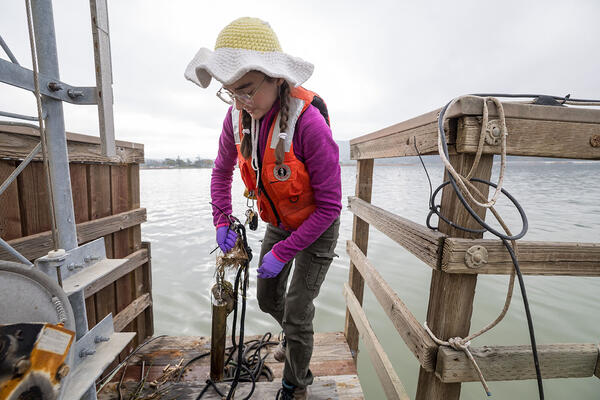 Scientist packs up gear used to gather shellfish samples
