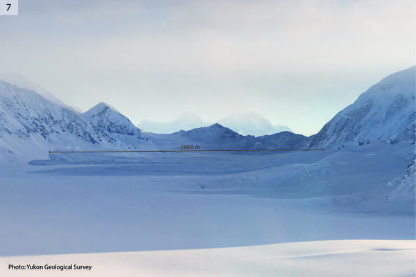 Snowy mountain and valley with label showing the size of the debris lobe as 1800m long