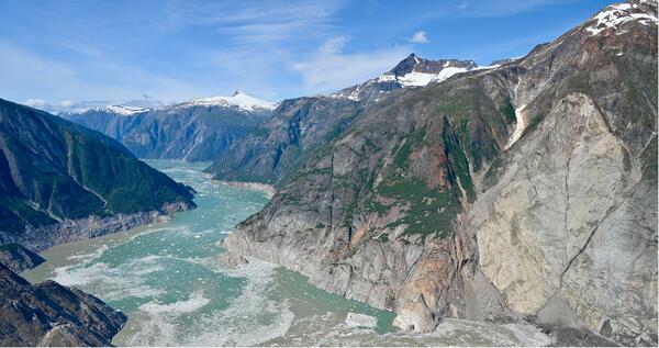 Aerial photo of mountainous landscape with landslide on the right hand side 