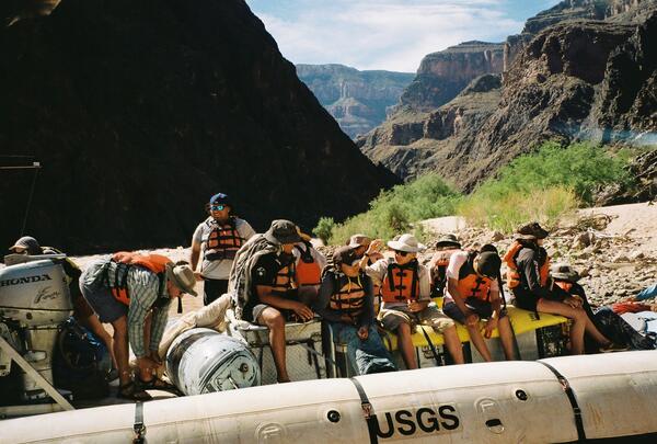 Grand Canyon Youth/Ancestral Lands Conservation Corps participants in a USGS boat on the Colorado River