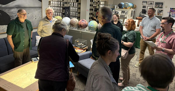 Shown are speakers and presenters mingling in the USGS Astrogeology Area