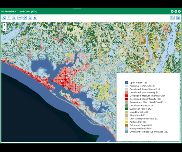 A map of a coastline with various shades of greens, browns, blues and reds on the land