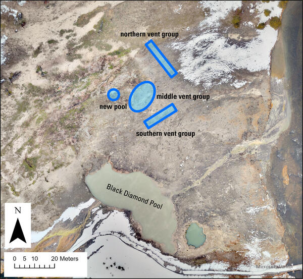 Aerial view with a muddy pool at the bottom and barren ground in the middle with blue polygons showing new vent locations