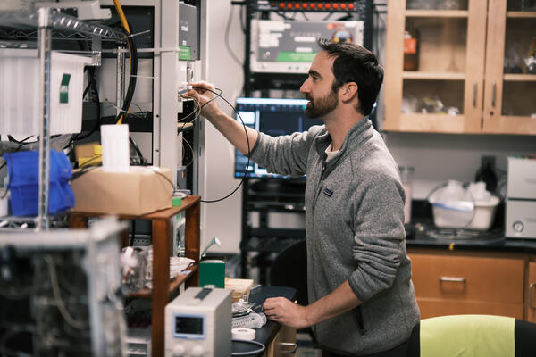 Person in lab working with equipment