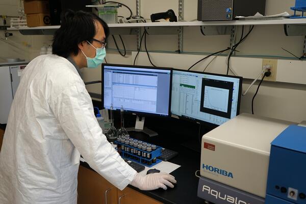 USGS scientist analyzing surface water samples for dissolved organic carbon concentration and characterization