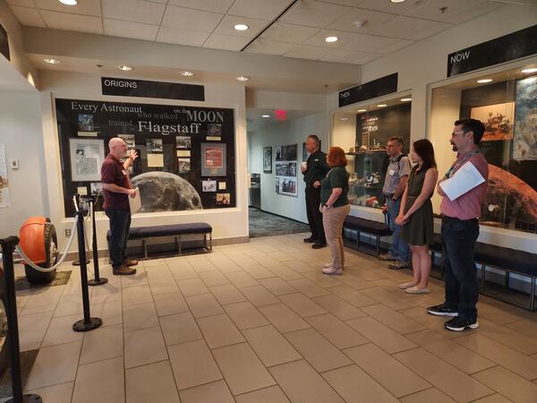 Tour Stop at Astrogeology Science Center: Discuss displays of historic artifacts on display in the lobby.