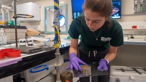 Photo of Hope Ianiri processing marine surface sediments