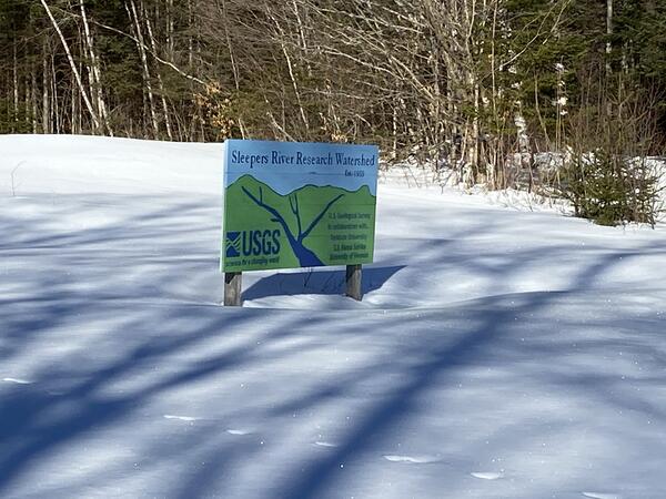 The sign of Sleepers River Research Watershed in the snow. 
