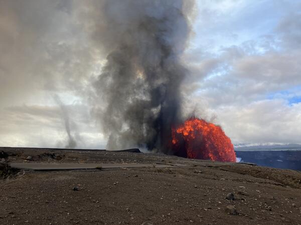 Color photograph of lava fountain and fallout