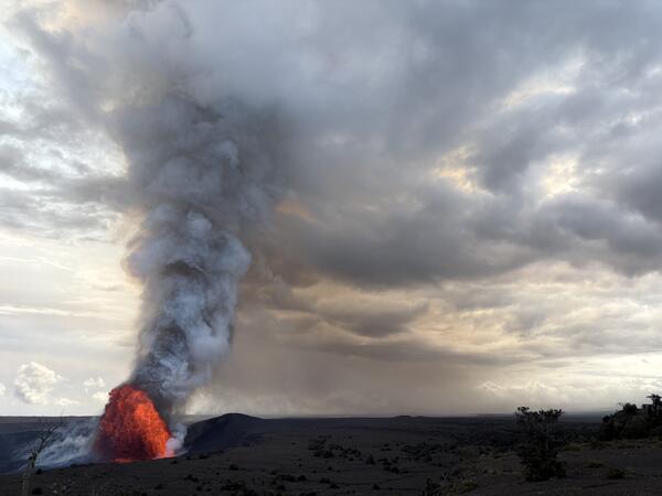 Color photograph of lava fountain and volcanic plume