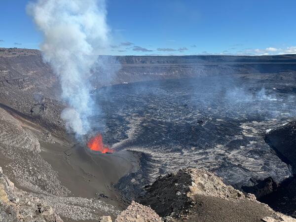 Color photograph showing erupting vent