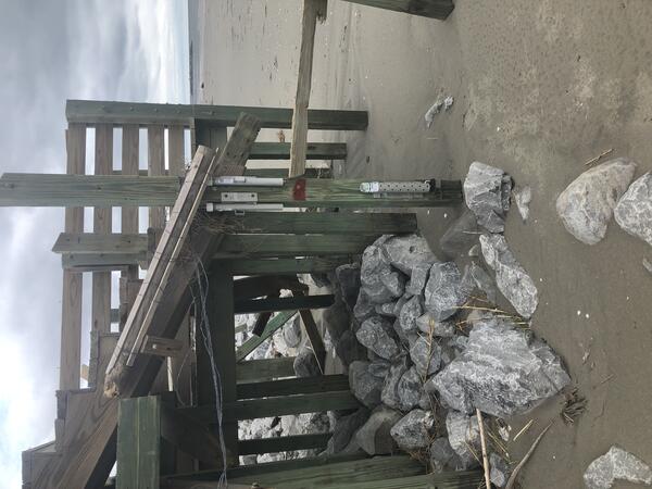 USGS storm tide sensor installed on a beach access pier in Grand Isle, Louisiana, for Hurricane Ida in 2021. The highest wave documented by this sensor during the hurricane was 13.48 feet on August 29. Photograph credit: James Fountain, USGS.