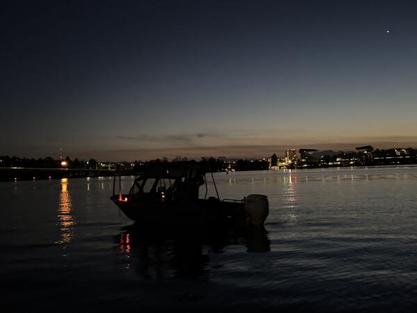 fieldwork boat on the water at dusk