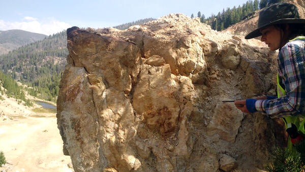 Geologist conducting field work within the Yellow Pine/Stibnite gold-antimony-tungsten mining area in central Idaho