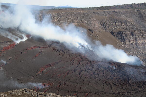 Color photograph of volcanic deposits around eruptive vents in Halemaʻumaʻu