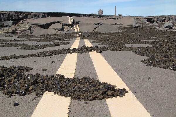 Color photograph of tephra on road
