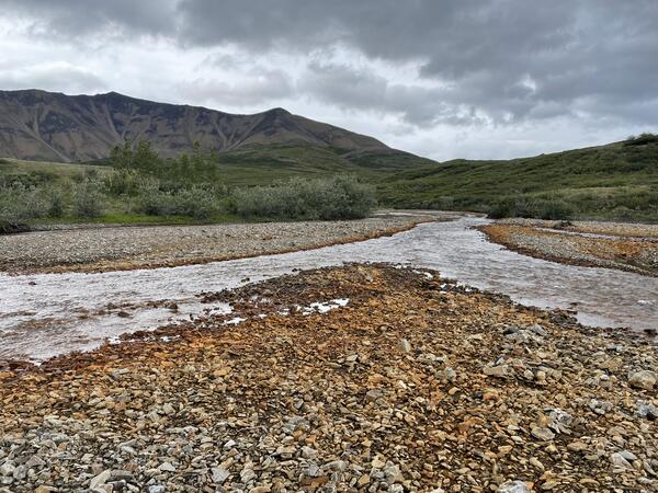 Orange stained rock along a creek.