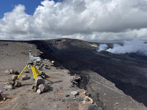 Color photograph of webcam on rim of volcanic crater