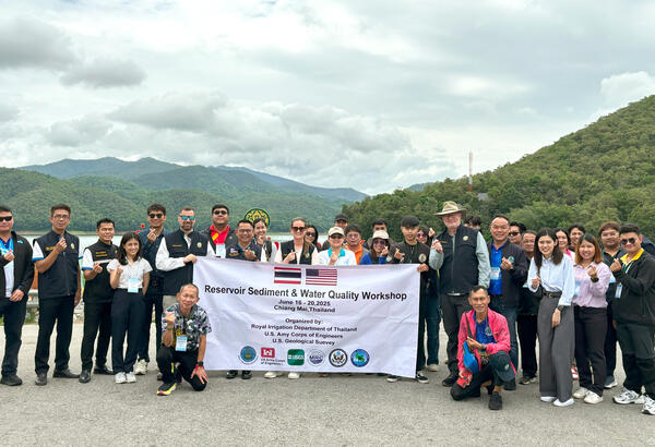 Participants in the water quality workshop gather on the Mae Ngat Somboon Chon Dam, Chiang Mai Province, Thailand 