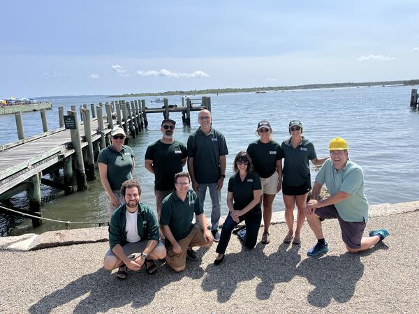 Group photo with the ocean in the background