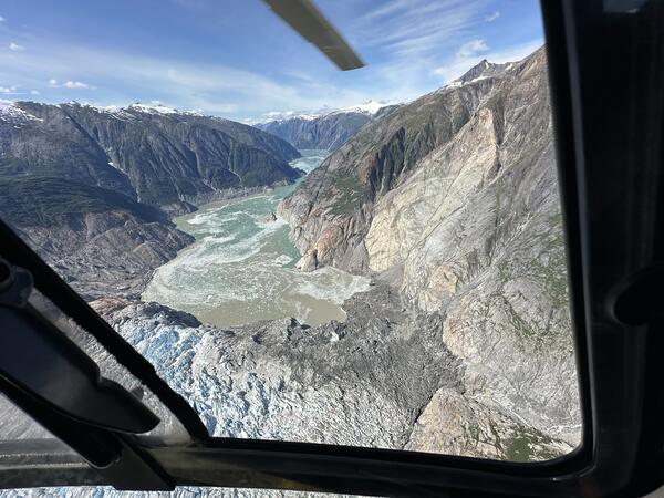 Aerial photo of landslide deposit at bottom of mountain and into the water