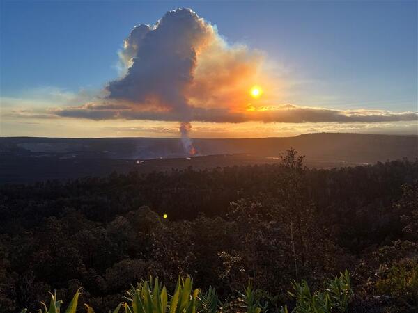 Color photograph of eruption and eruption plume