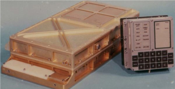 Photo of Apollo Guidance Computer (a gold box with attachments, left) and the DSKY (a gray box with buttons)