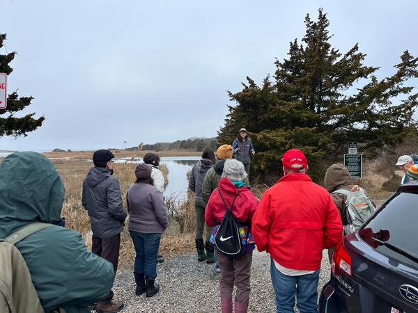 Group outside listening to speaker