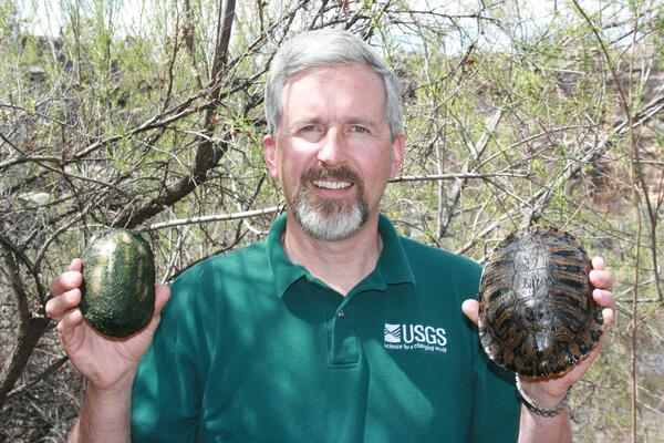 Dr. Jeff Lovich holding 2 turtles near Montezuma Well in AZ