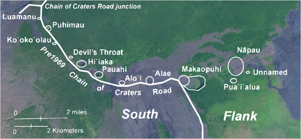 Color satellite image with craters and road annotated in white