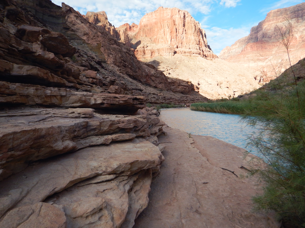 The light blue Little Colorado River winds through a rocky canyon in Grand Canyon
