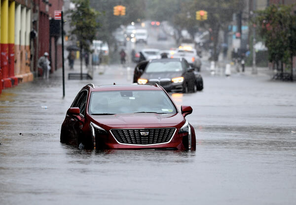 Abandoned cars on a flooded street in Brooklyn, NY.