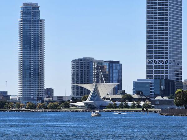 Milwaukee Harbor in foreground with Discovery World building and other tall buildings in background
