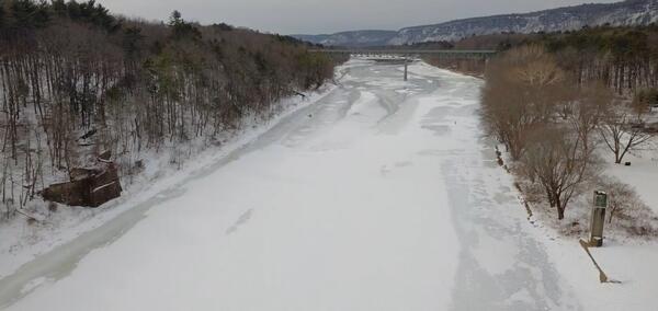looking out over the frozen Delaware River from an aerial vantage