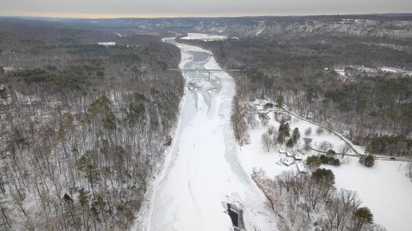 Aerial view of Montague Bridge looking downstream at the frozen Delaware River