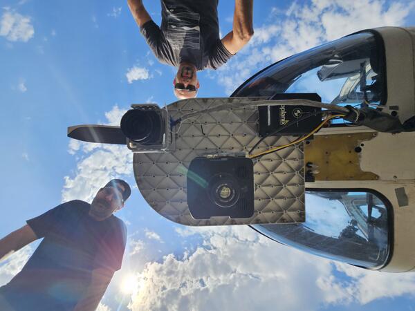 Underside of Bell Jet Helicopter with thermal infrared and true-color image sensors and JN and M.D.