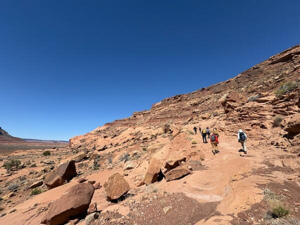Geologists and members of the Navajo Nation conduct geologic mapping fieldwork.