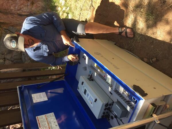 Graduate student working on a Passive Integrated Transponder (PIT) tagging array