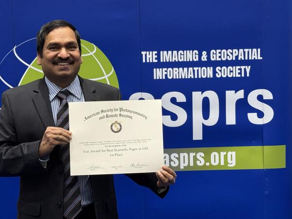 Pardhasaradhi Teluguntla presenting certificate of ESRI's Award for Best Scientific Paper in GIS -1st Place